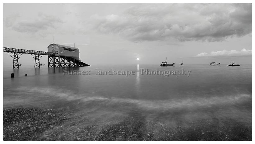 slides/Selsey Bill Mono Moon Rise.jpg full moon,rising,selsey bill, west sussex,coast,water,boats, royal national life boat institution,mono,black and white Selsey Bill Mono Moon Rise